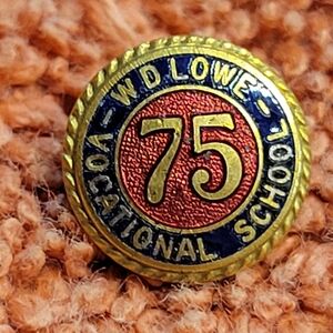 Vintage 75 yr W.D. Lowe vocational school lapel pin.